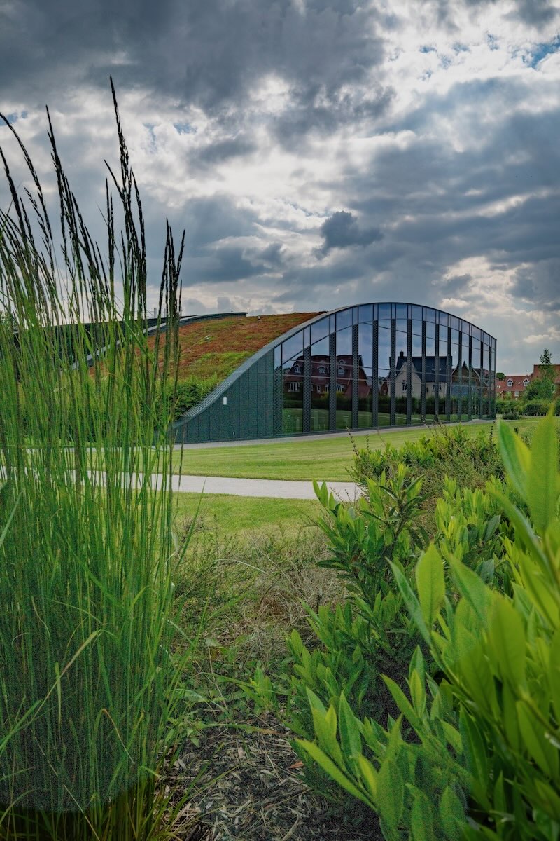 Curved exterior of the CABI building with a green roof near Wallingford