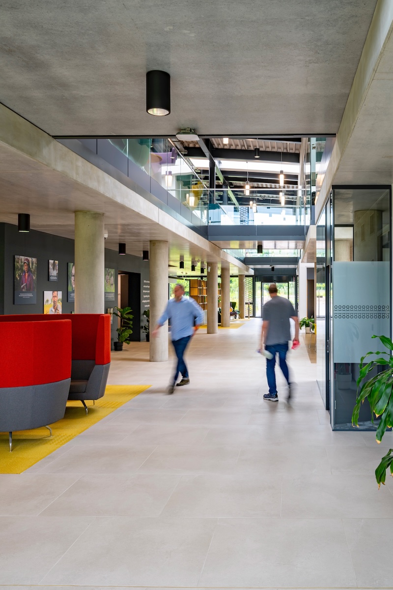People walking through the modern atrium at the CABI building near Wallingford